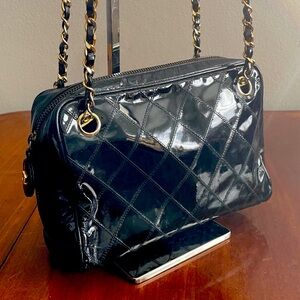 A Vintage Chanel quilted black patent leather camera bag, authentic